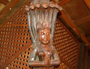 brown wooden deity god sculpture thumbnail