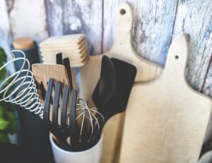 black and brown wooden kitchen tools in white container thumbnail