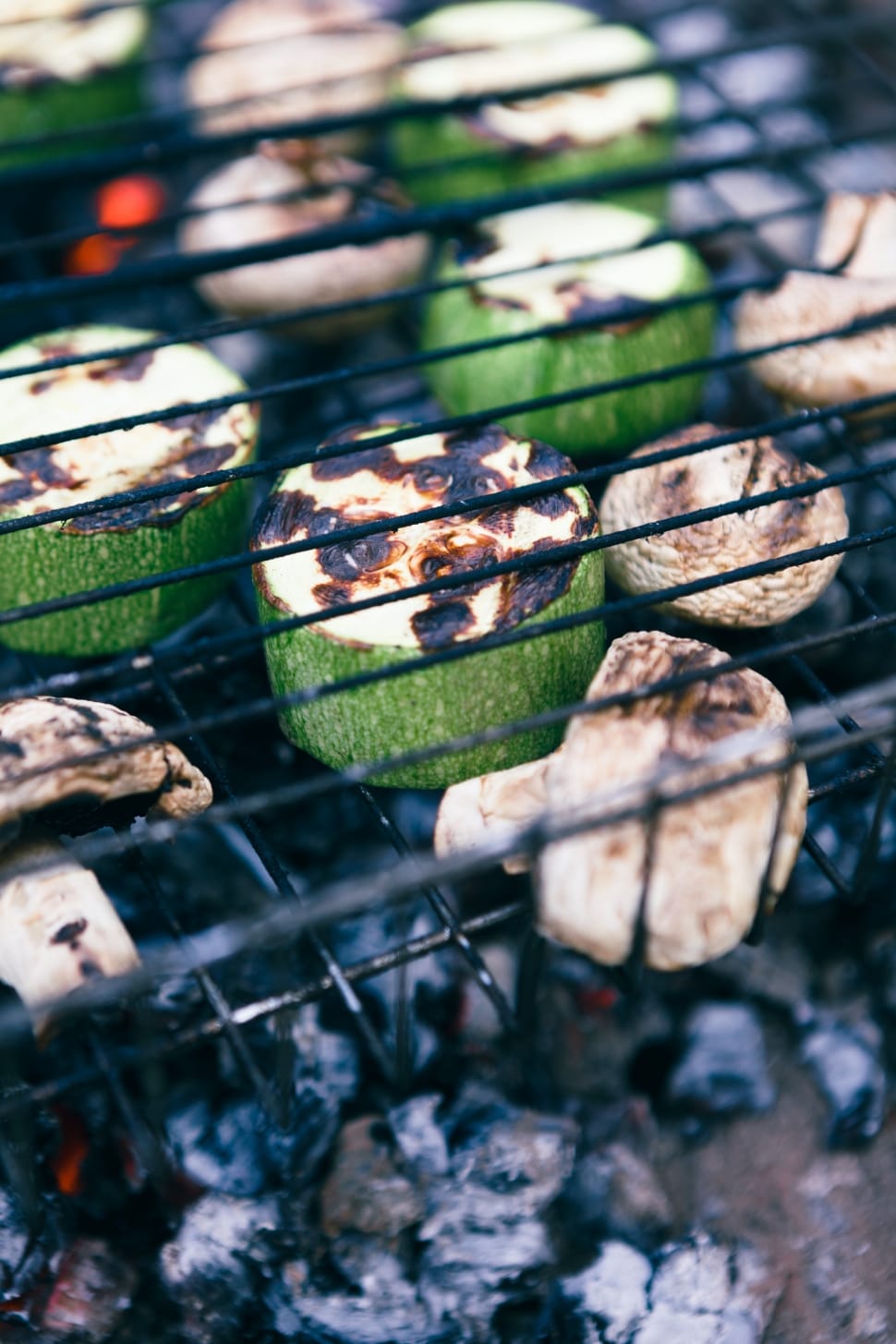 grilled mushrooms and cucumbers on charcoal grill preview