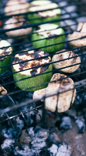 grilled mushrooms and cucumbers on charcoal grill thumbnail