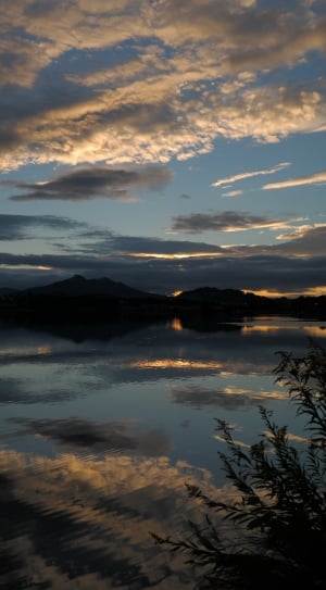 reflection of clounds on lake during dawn thumbnail