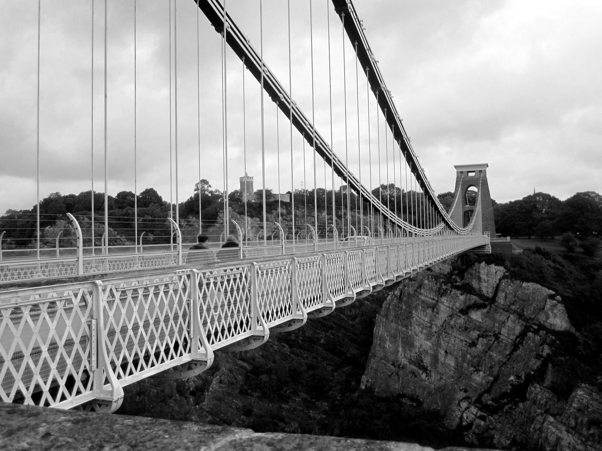 gray scale photo of a bridge