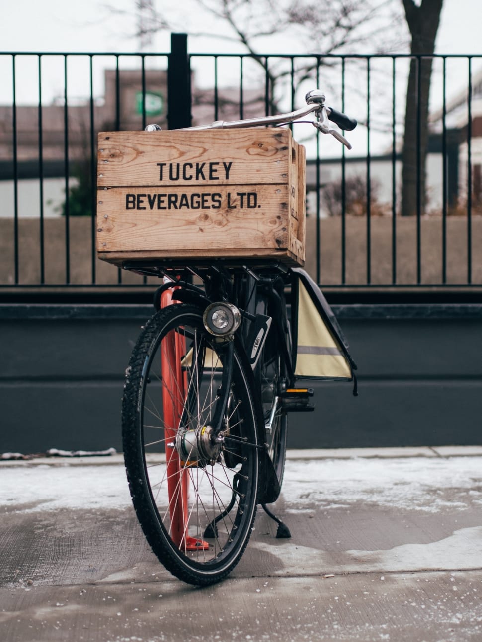 brown tuckey beverages ltd box and black bicycle preview
