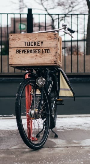 brown tuckey beverages ltd box and black bicycle thumbnail