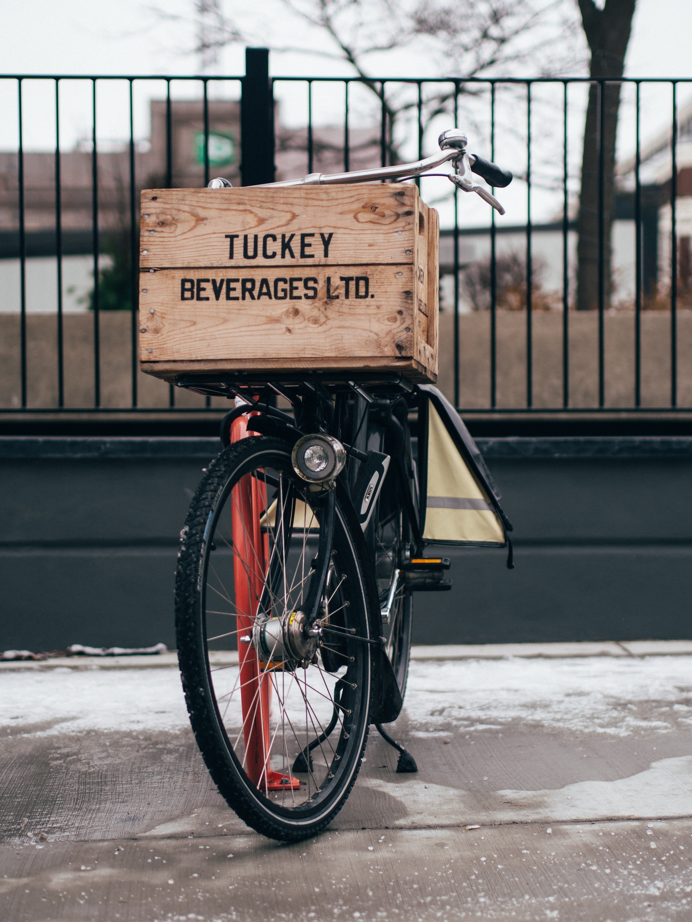brown tuckey beverages ltd box and black bicycle
