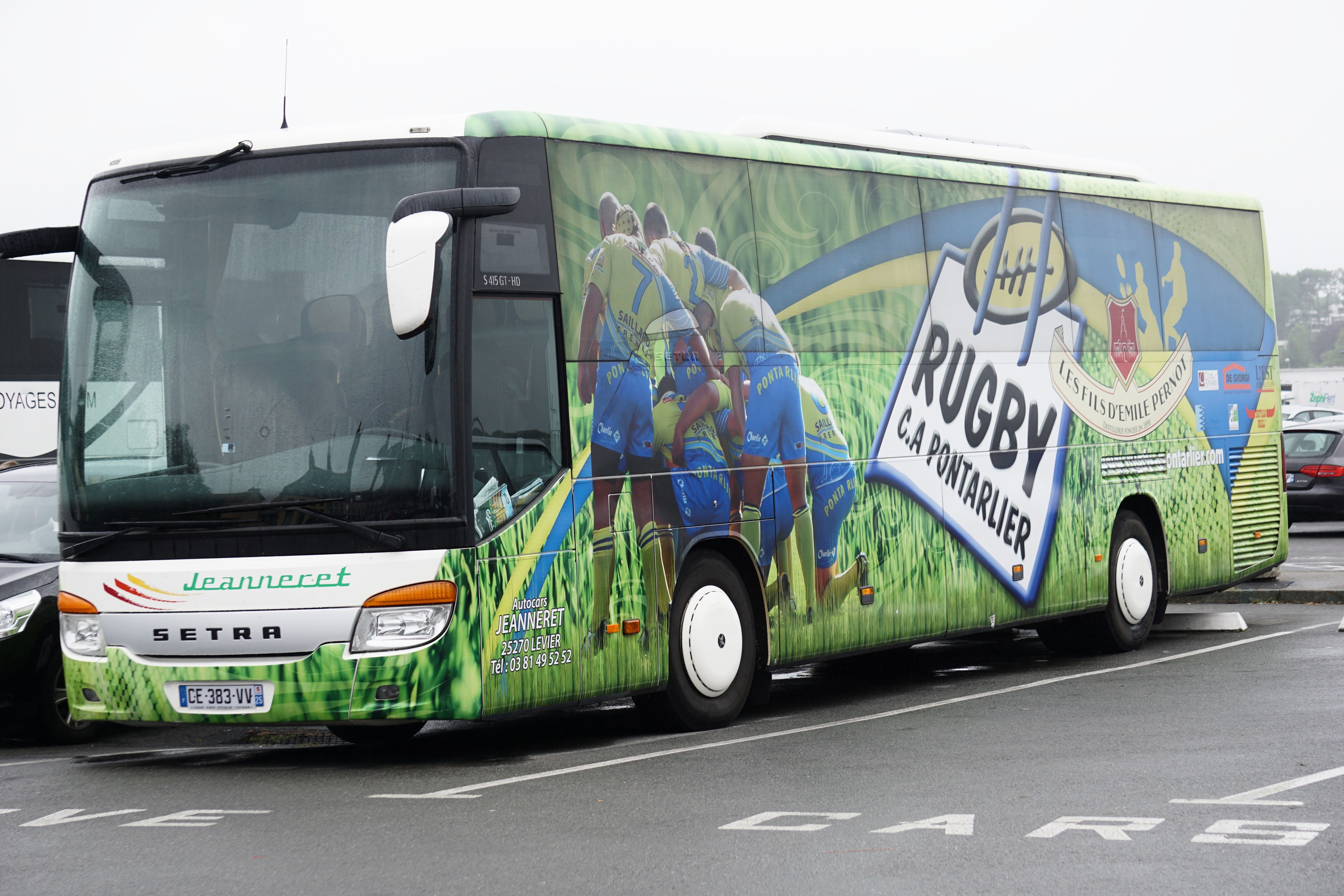 white and green rugby bus
