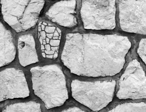 greyscale photo of grey concrete bricks thumbnail