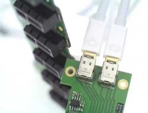 two plugin micro usb cables on green microchip thumbnail
