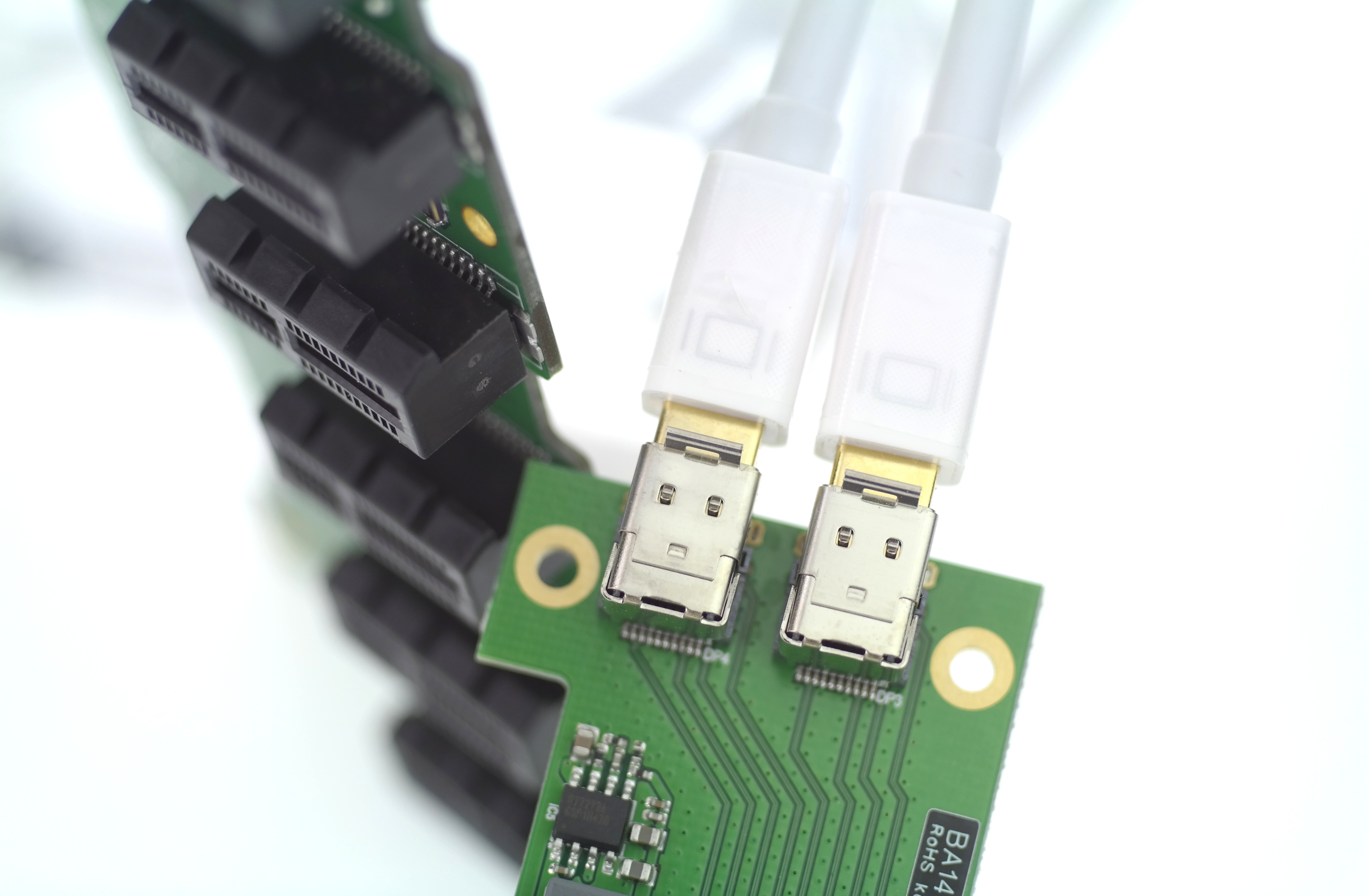 two plugin micro usb cables on green microchip
