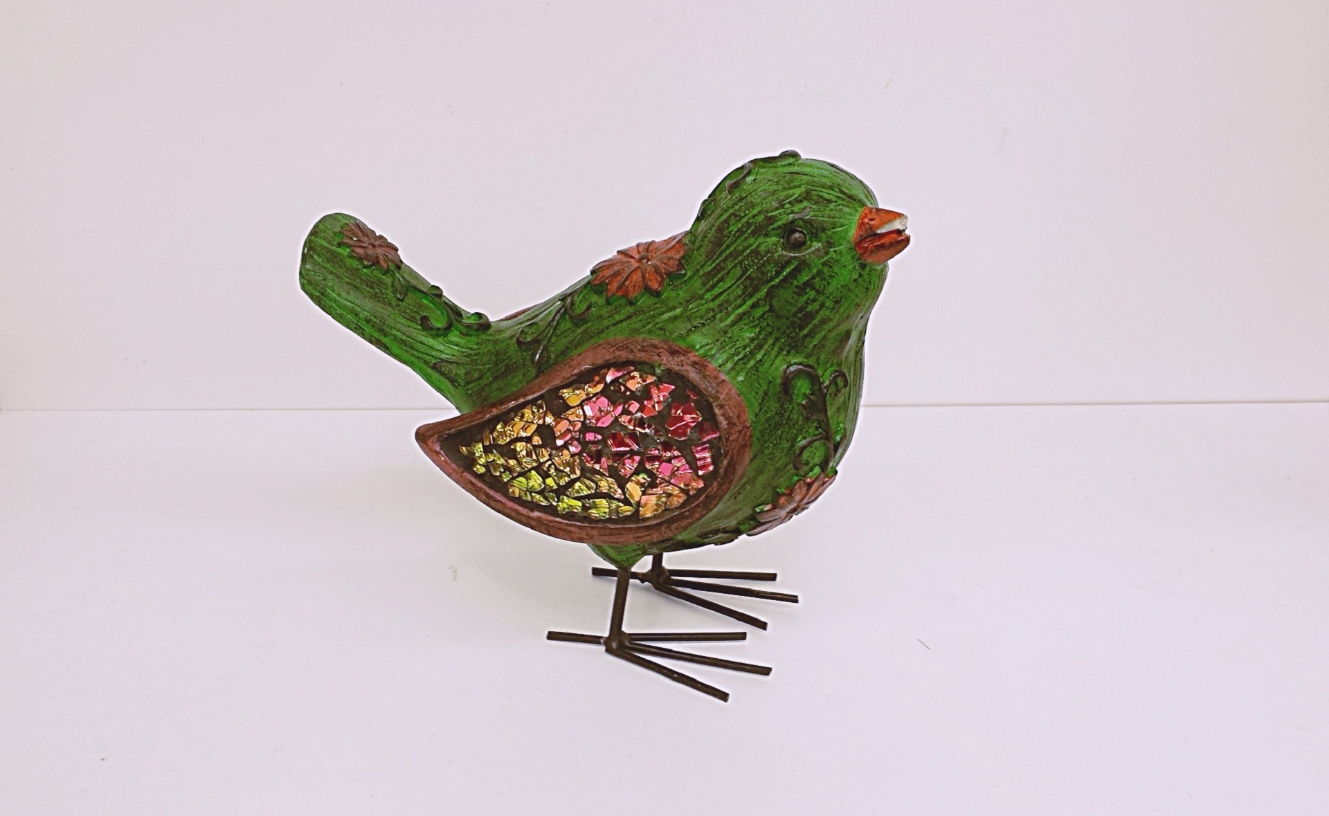 green, red and yellow bird ornament