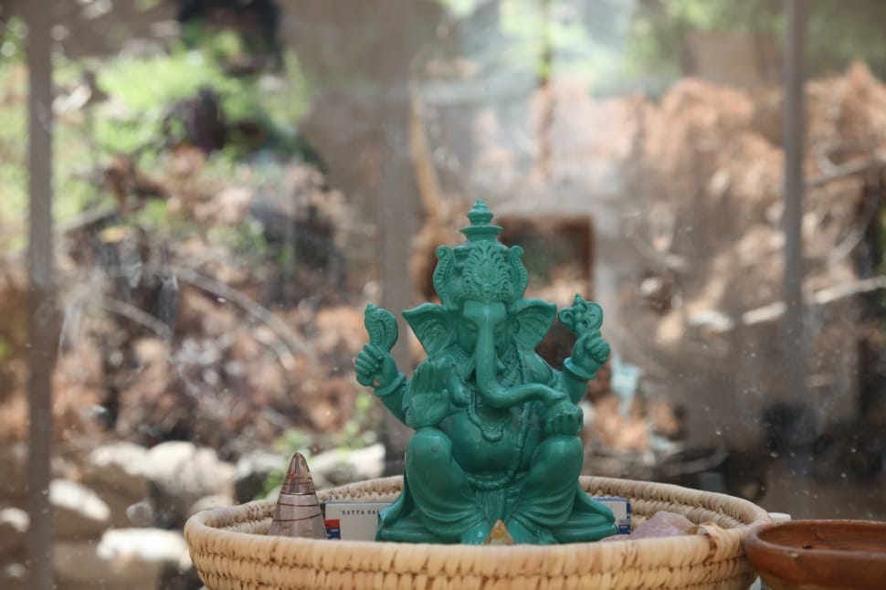 teal Ganesha figurine close up photo preview