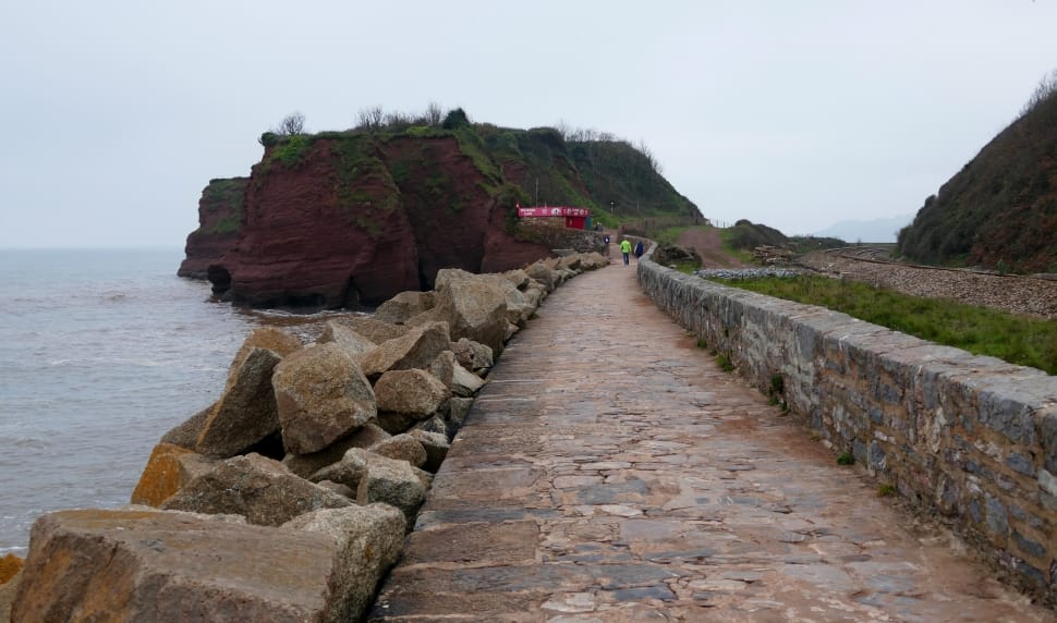 concrete wall and pathway along sea side preview