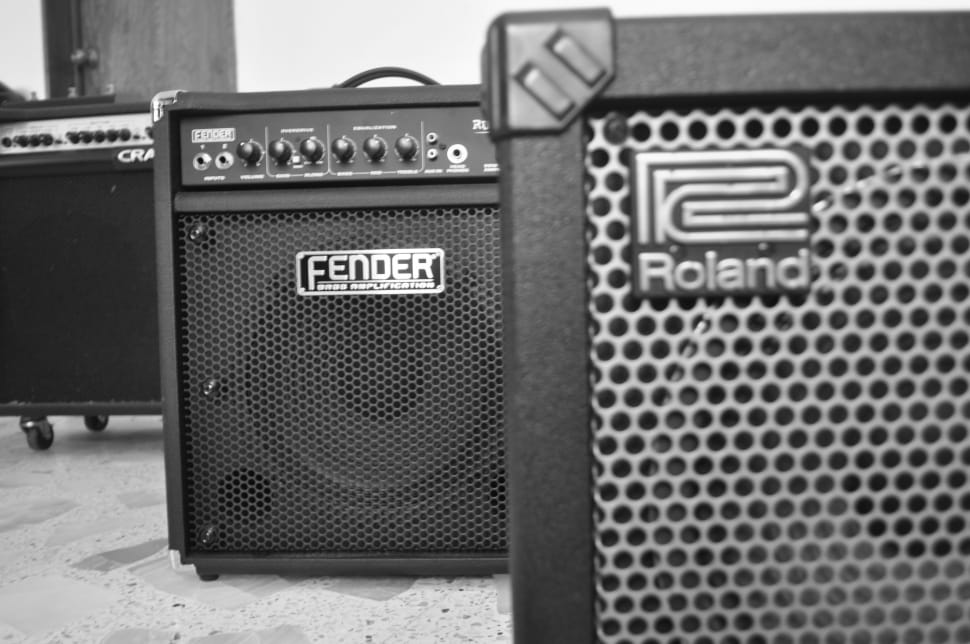 gray roland guitar amplifier and black fender guitar amplifier preview
