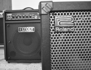gray roland guitar amplifier and black fender guitar amplifier thumbnail