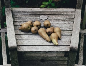 sweet potatoes on brown wooden table thumbnail