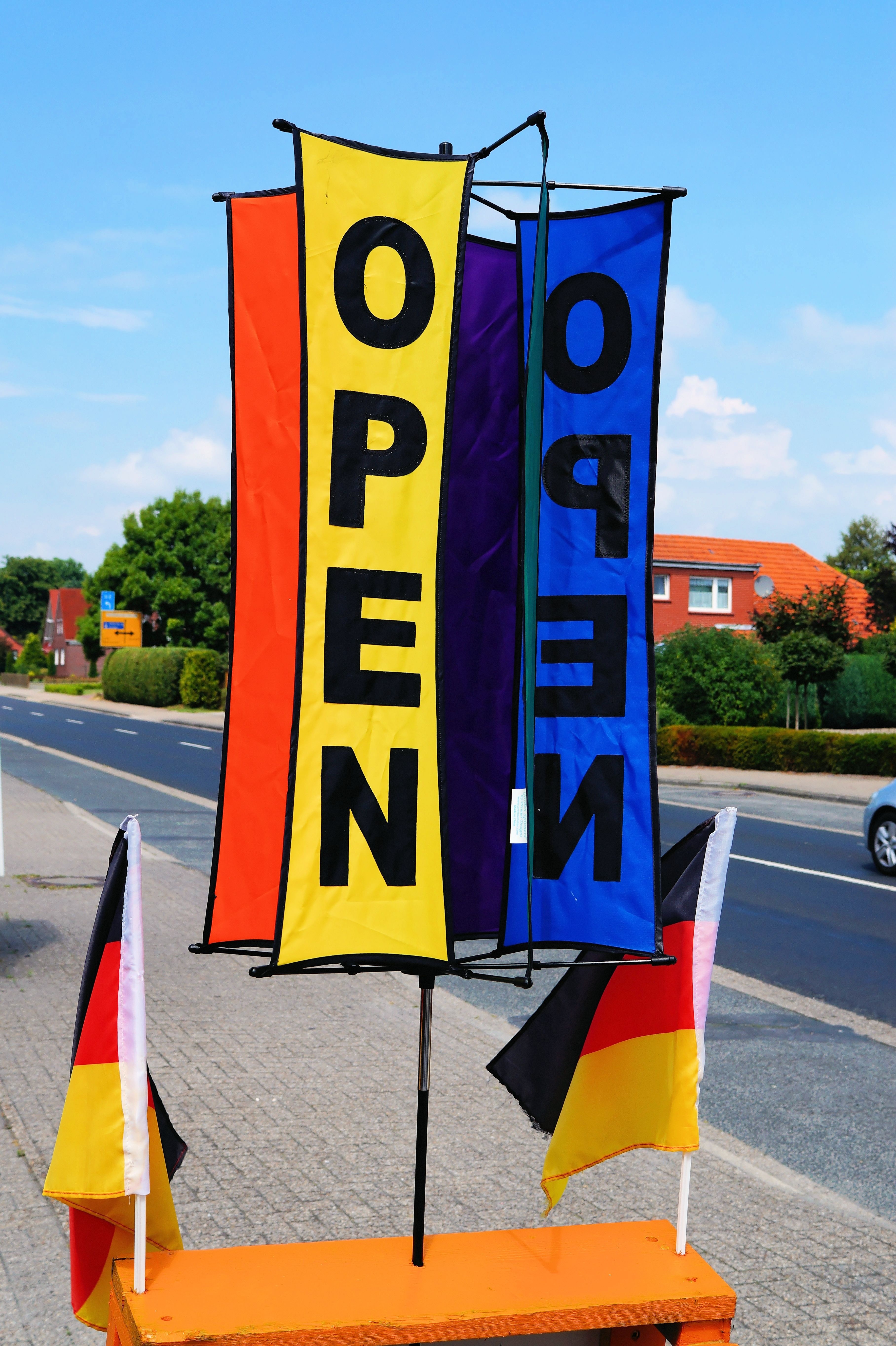 yellow blue and red open signage