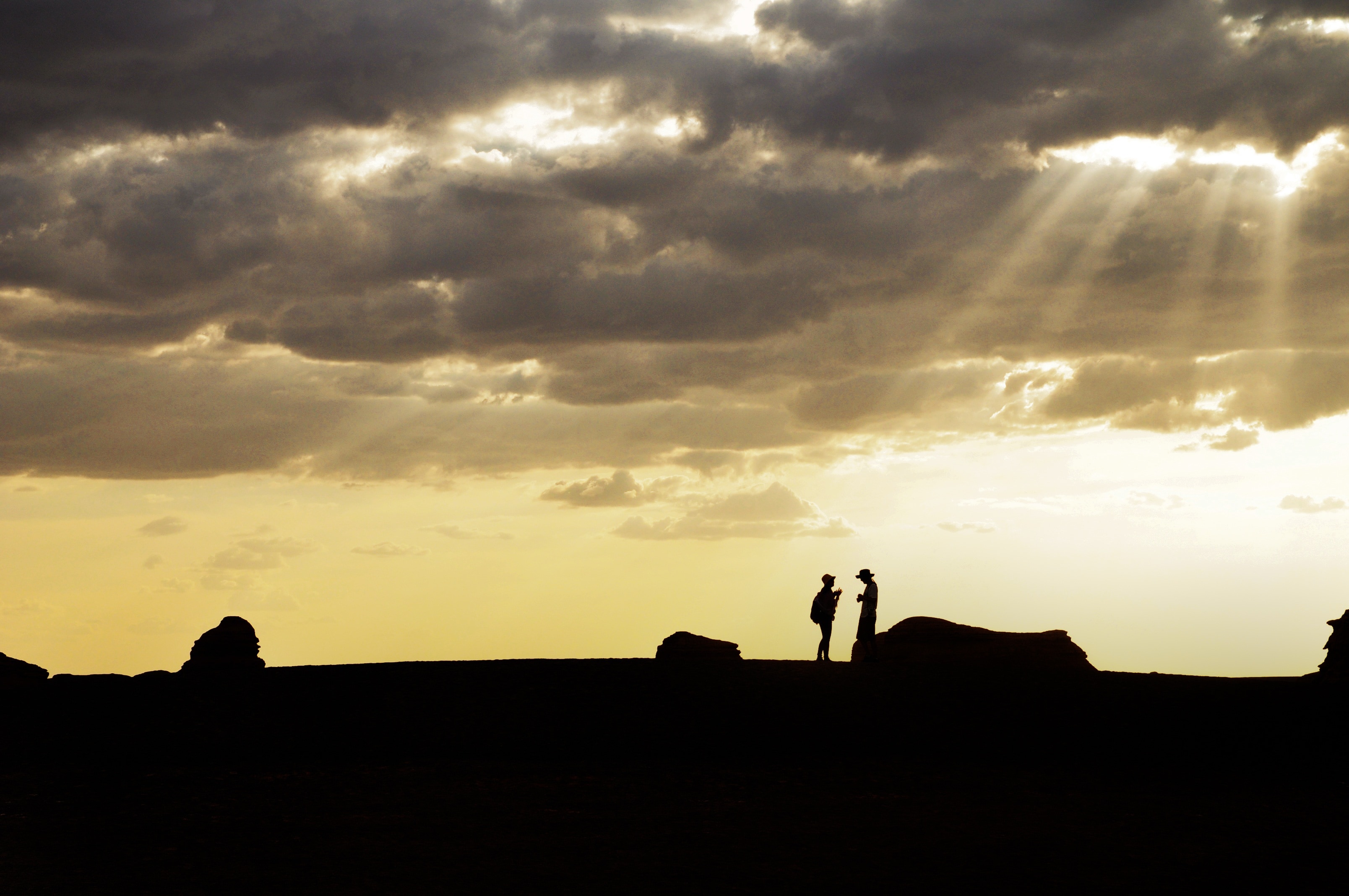 silhouette of 2 persons