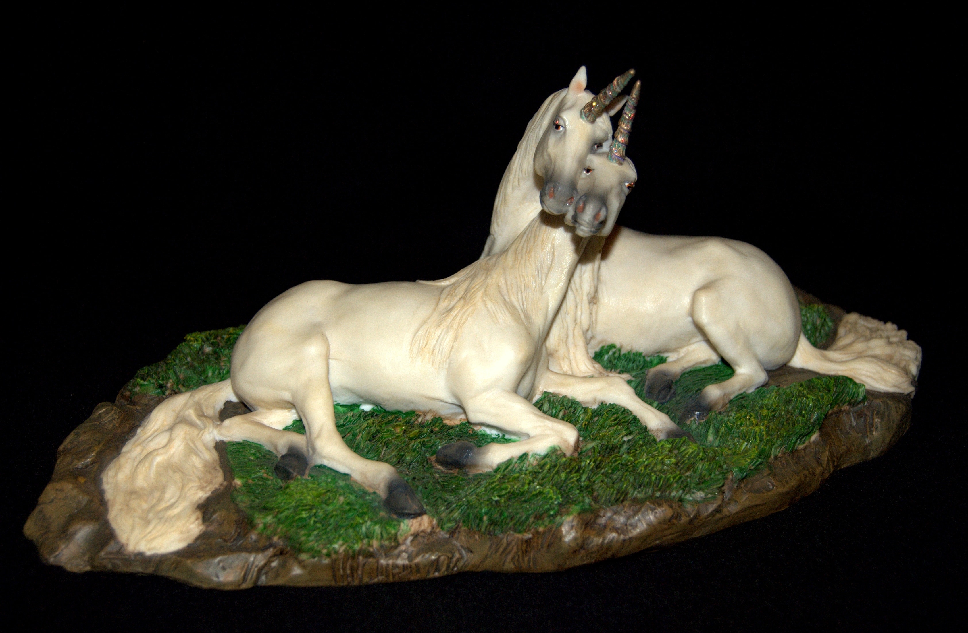 2 white unicorn figurine