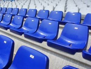 blue and white plastic chairs inside the stadium thumbnail