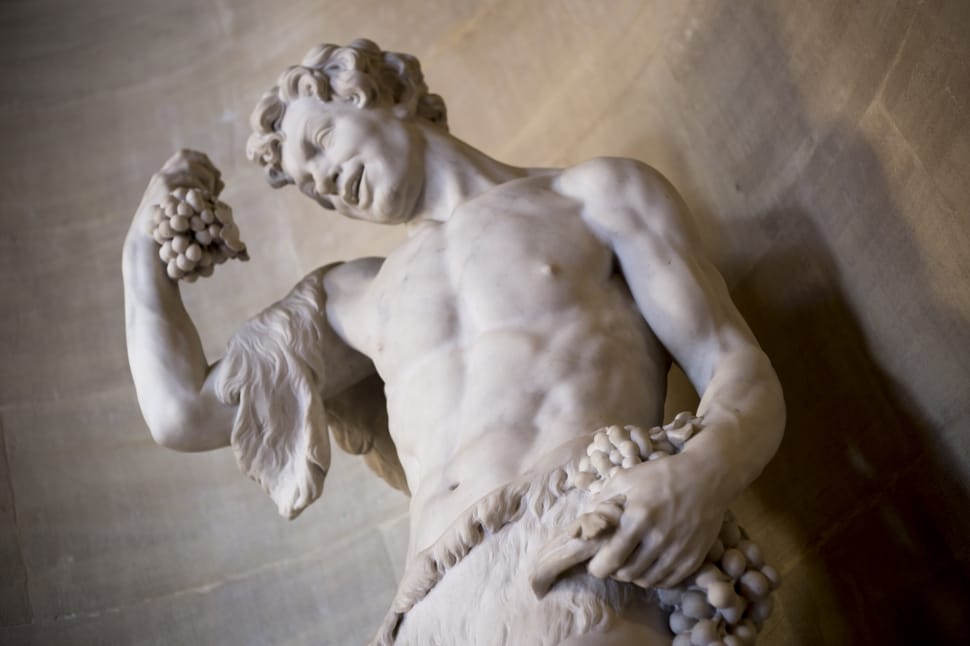 human statue holding grapes preview