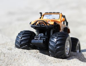 yellow and black monster truck toy thumbnail