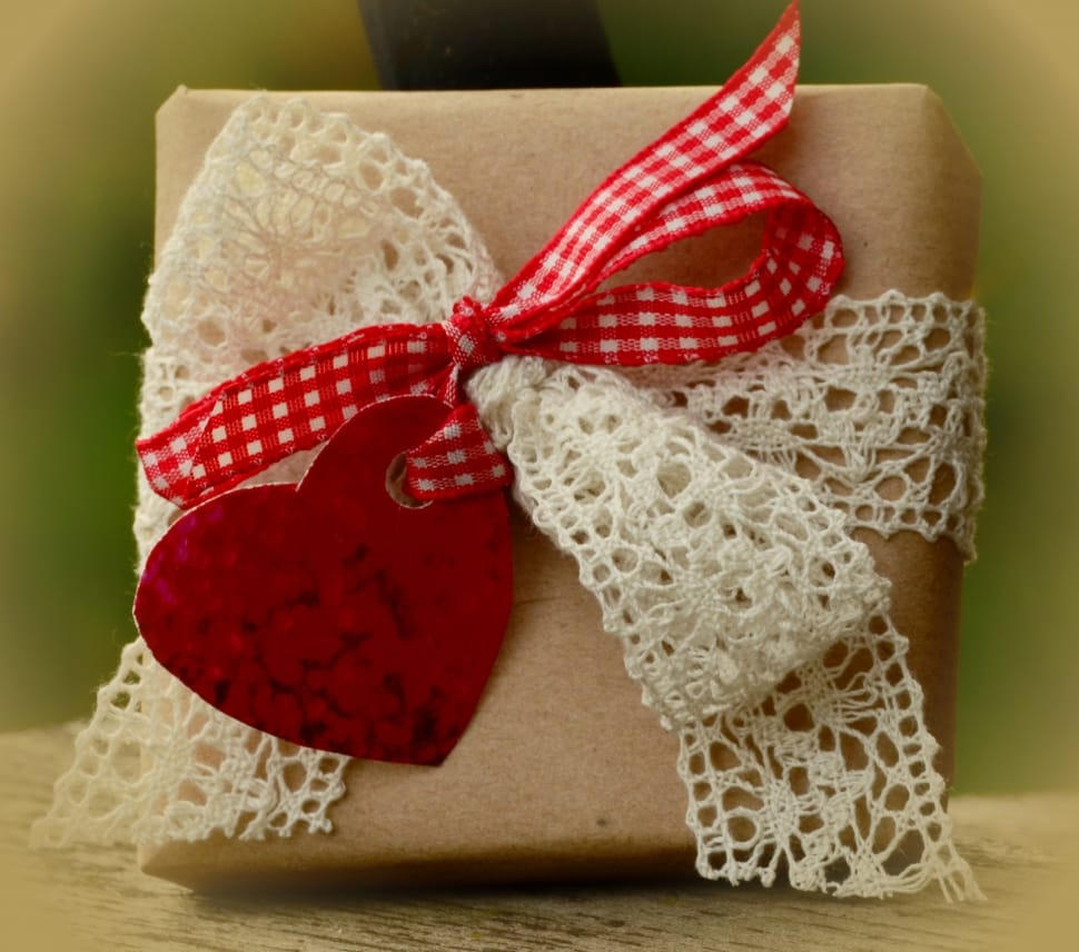 brown box with white and red bow preview