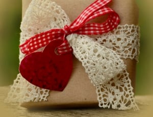 brown box with white and red bow thumbnail