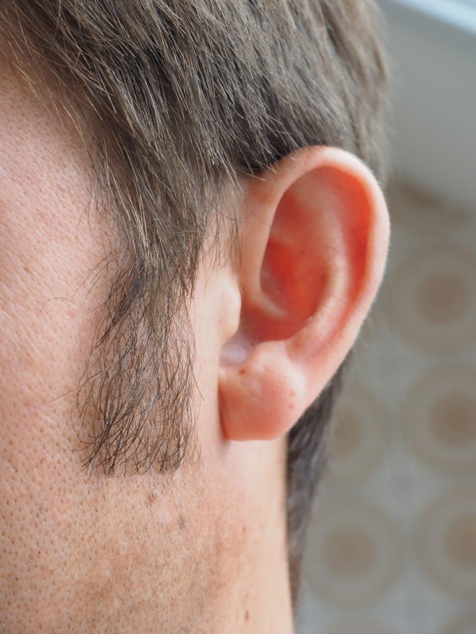 man's left ear preview