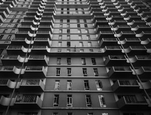 gray scale photo of high rise building thumbnail