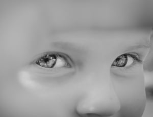 close up grayscale photography of child's eyes thumbnail