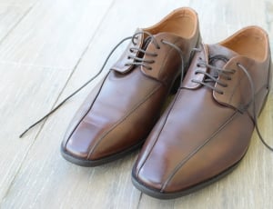 brown leather shoes on floor thumbnail