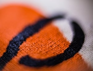black orange and white textile thumbnail