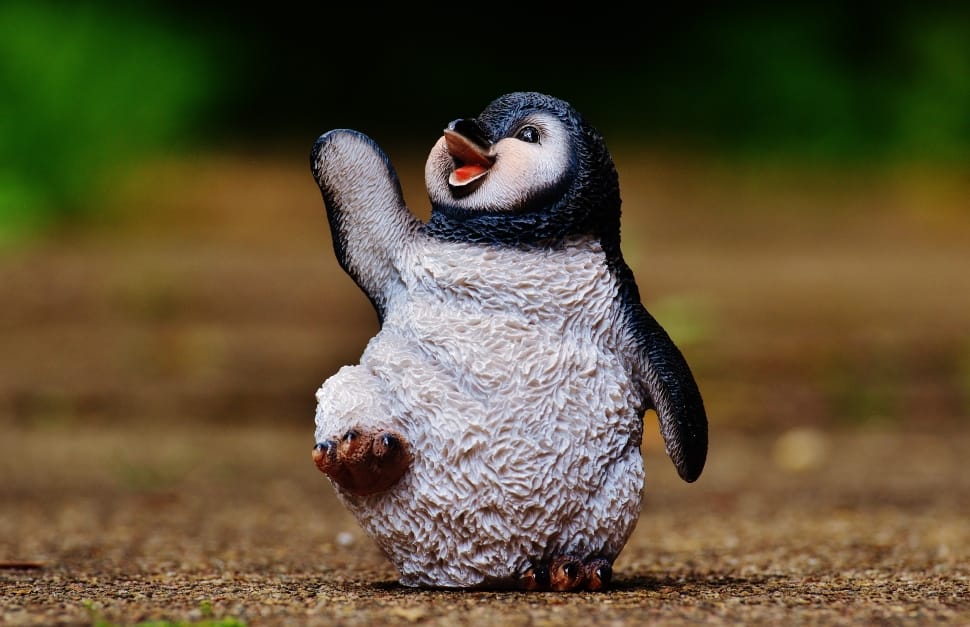 white and black penguin figurine preview