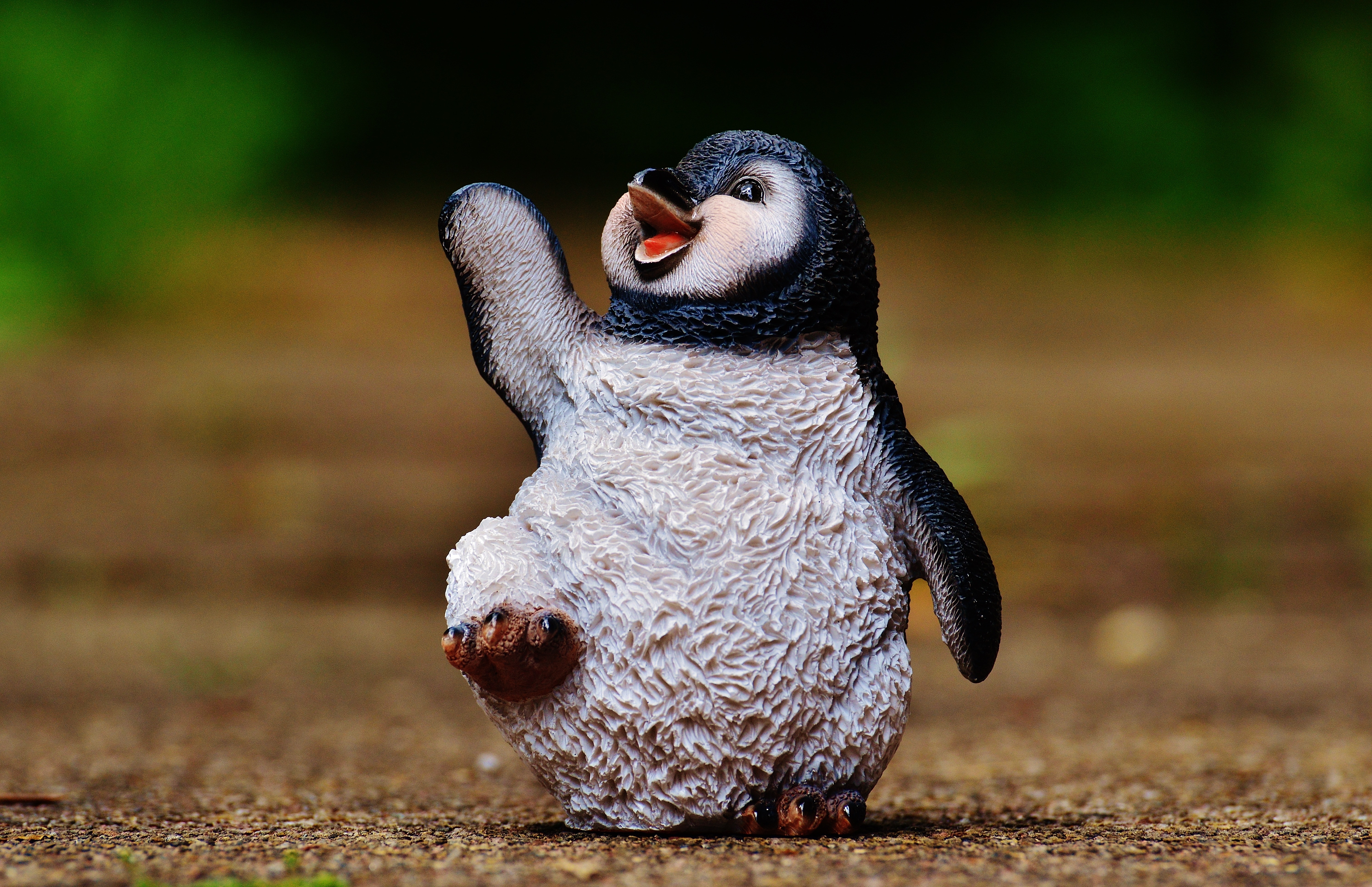 white and black penguin figurine