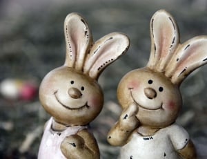 2 brown and white smiling bunny figurine thumbnail