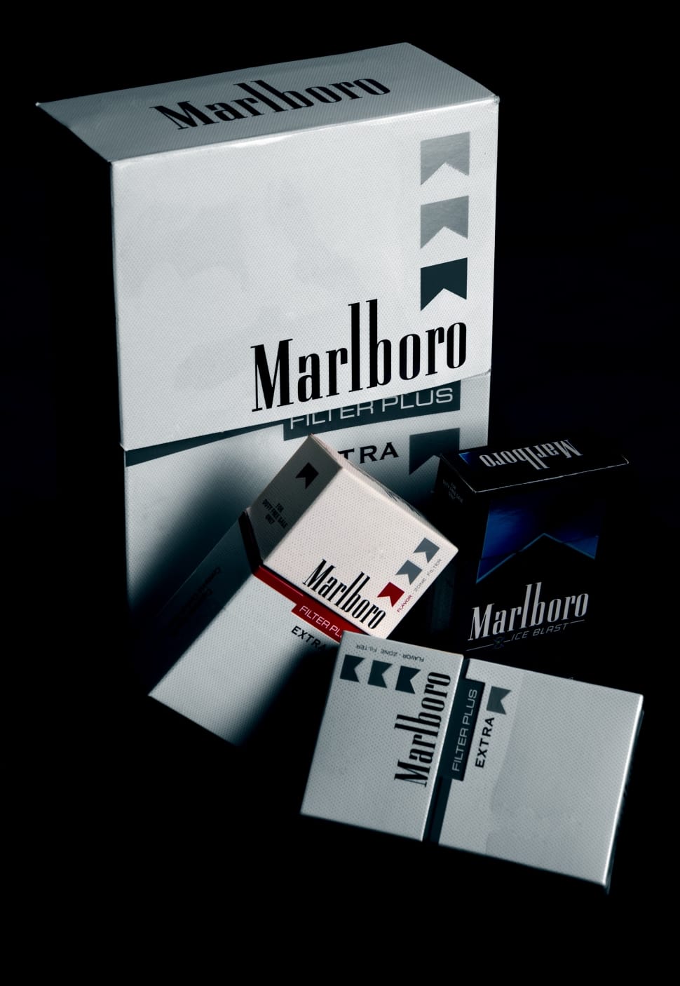 three black and white Marlboro flip top cigarette boxes preview
