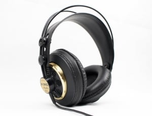 black and brown corded headphones on white surface thumbnail