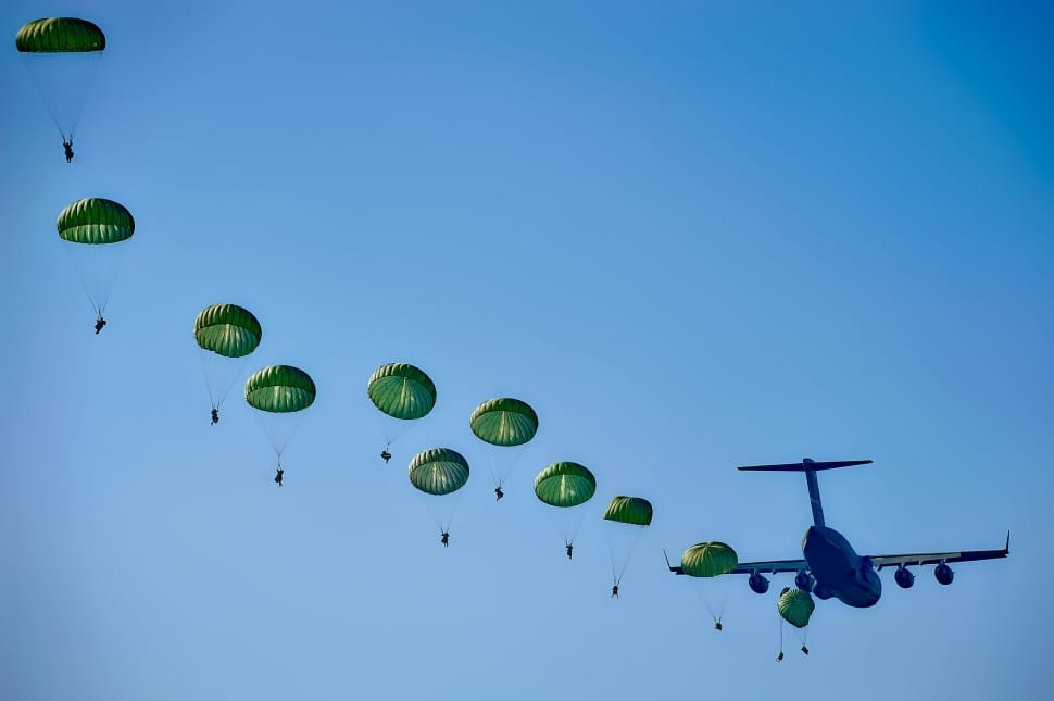 green parachutes and blue airplane preview