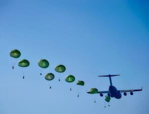 green parachutes and blue airplane thumbnail