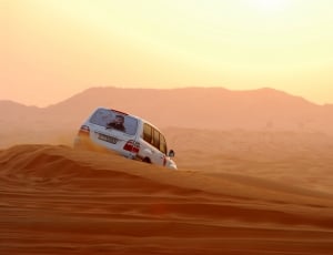 white SUV on desert thumbnail