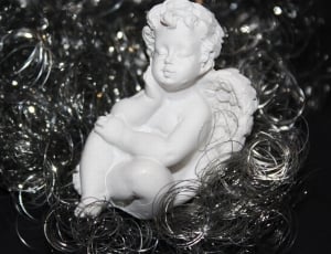 white cherub ceramic figurine thumbnail