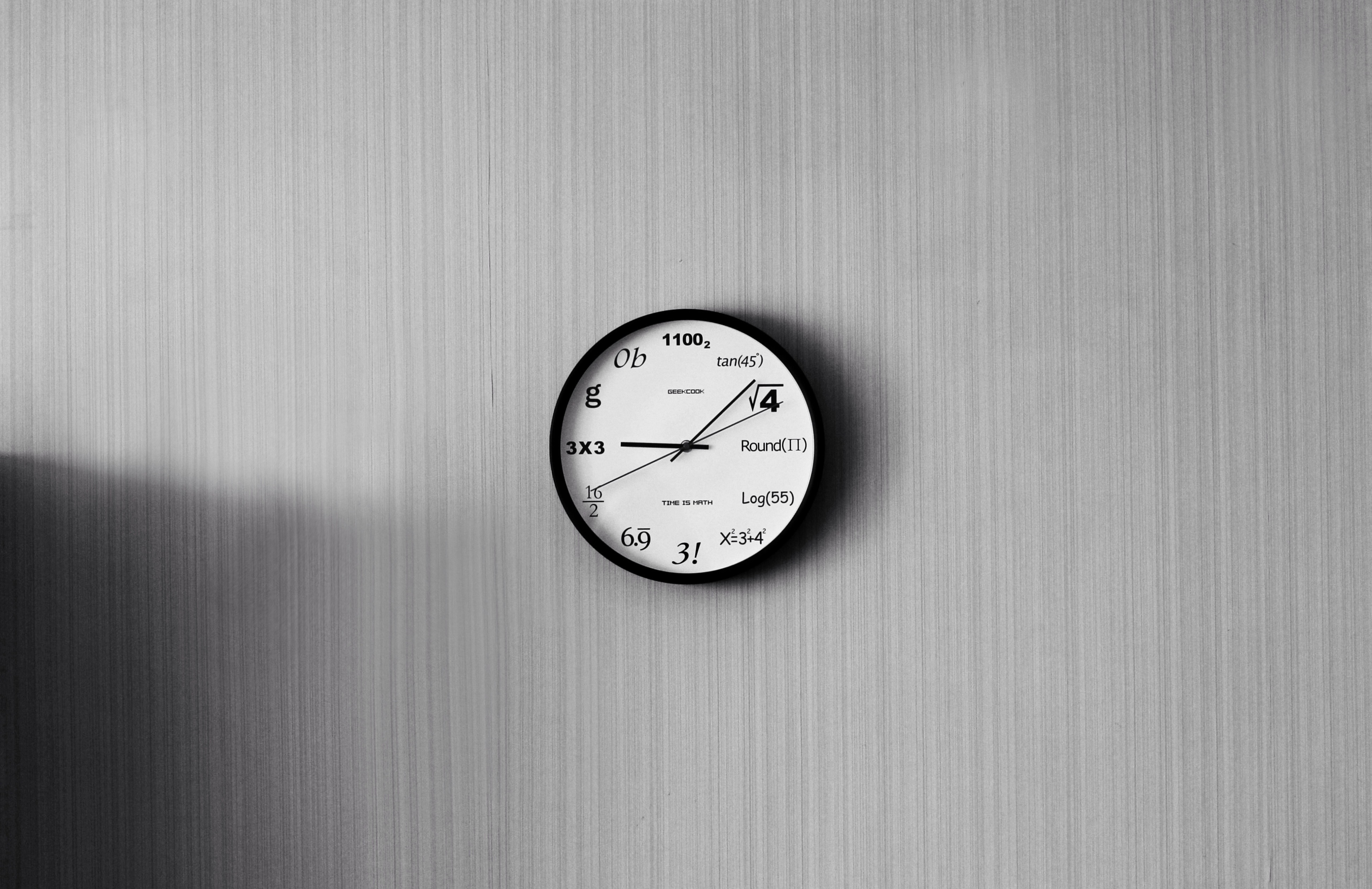 black and white round analog clock