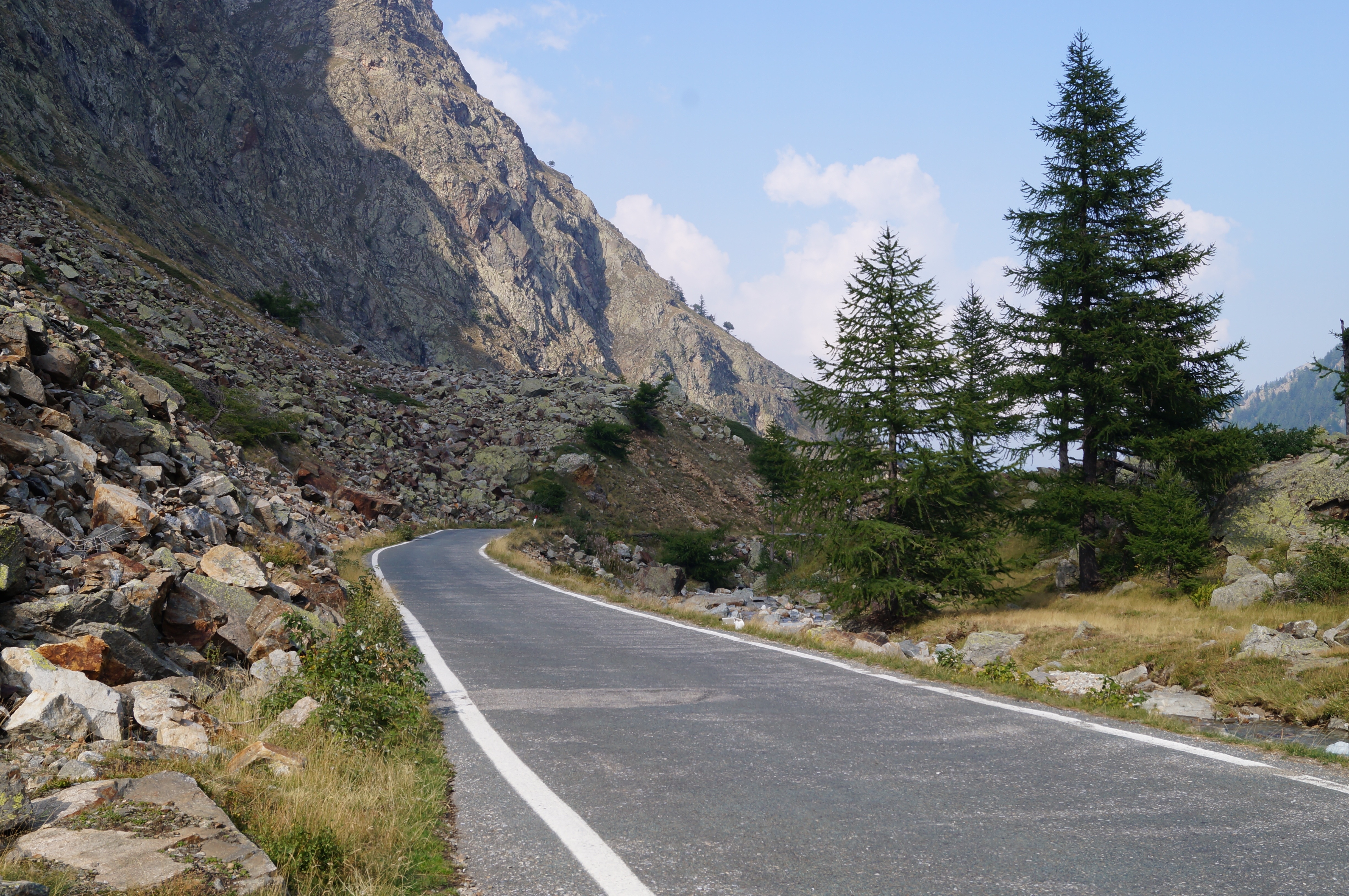 grey concrete road near mountain