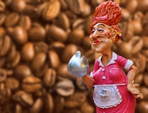 female in pink dress maid holding silver kettle figurine thumbnail