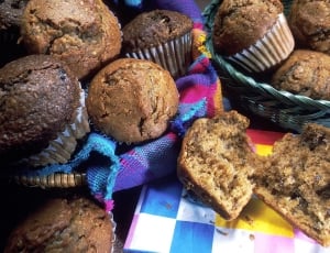 close up photography of freshly baked chocolate cupcakes in basket thumbnail