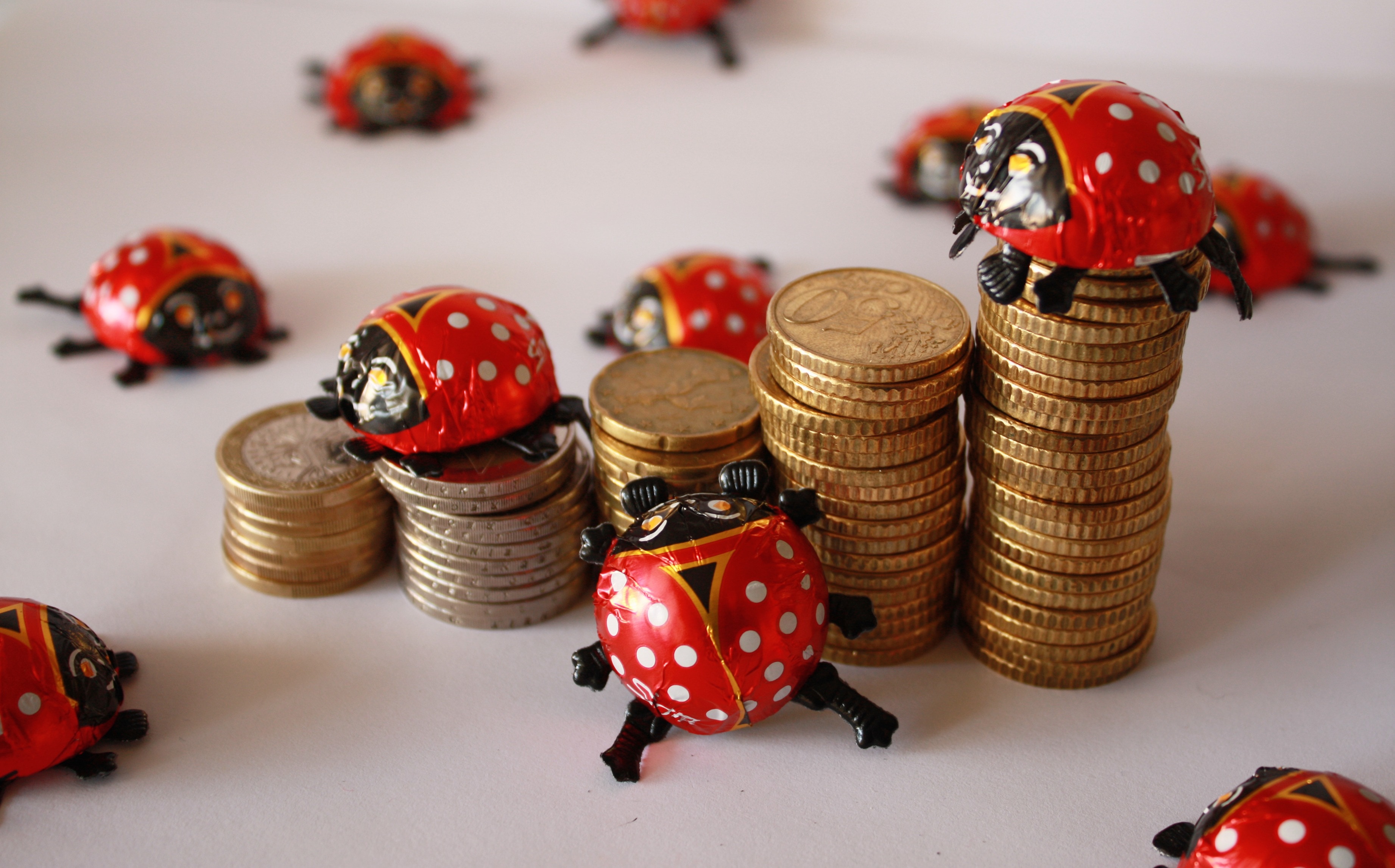 plastic lady bug and gold coin lot