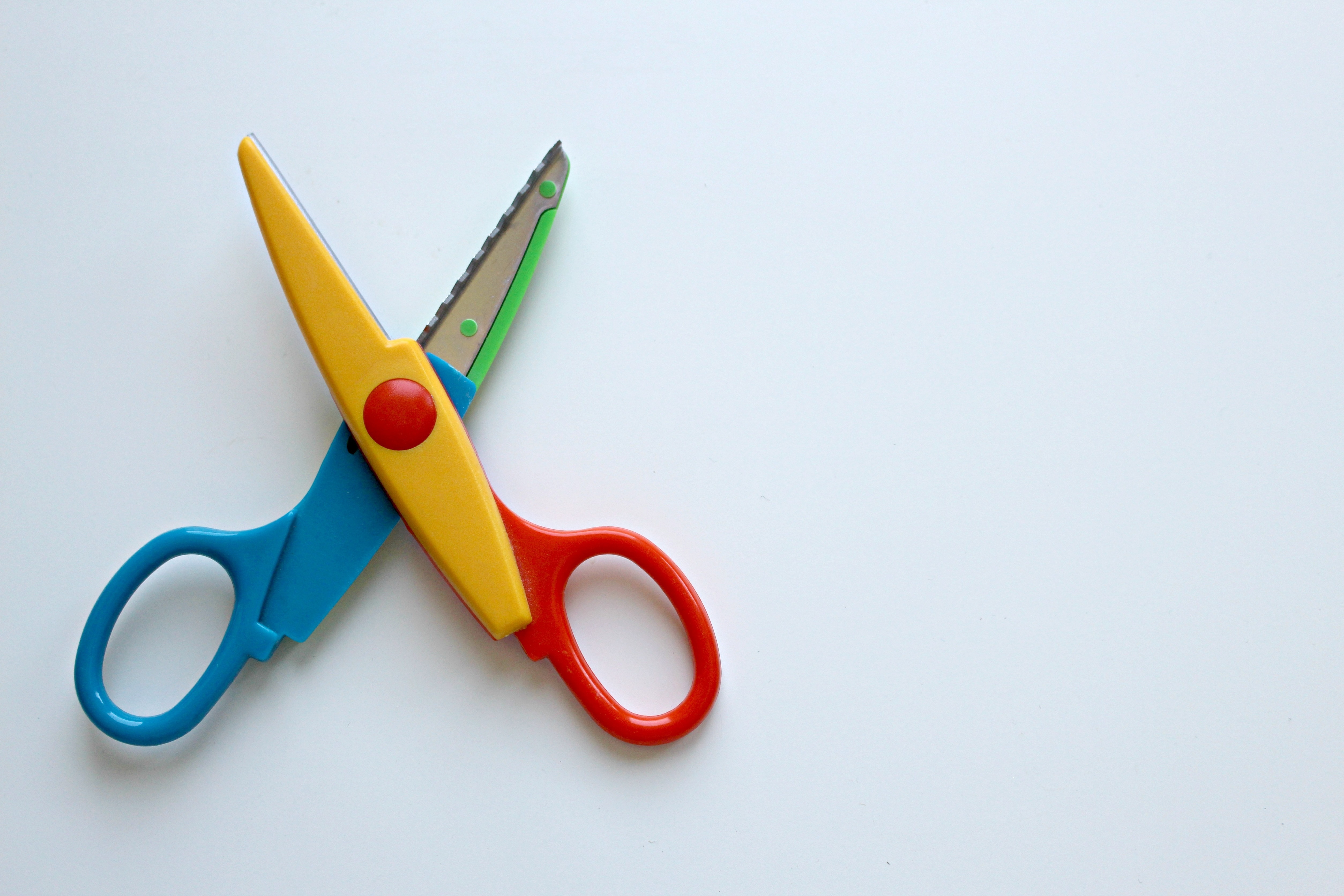 yellow red and blue scissors