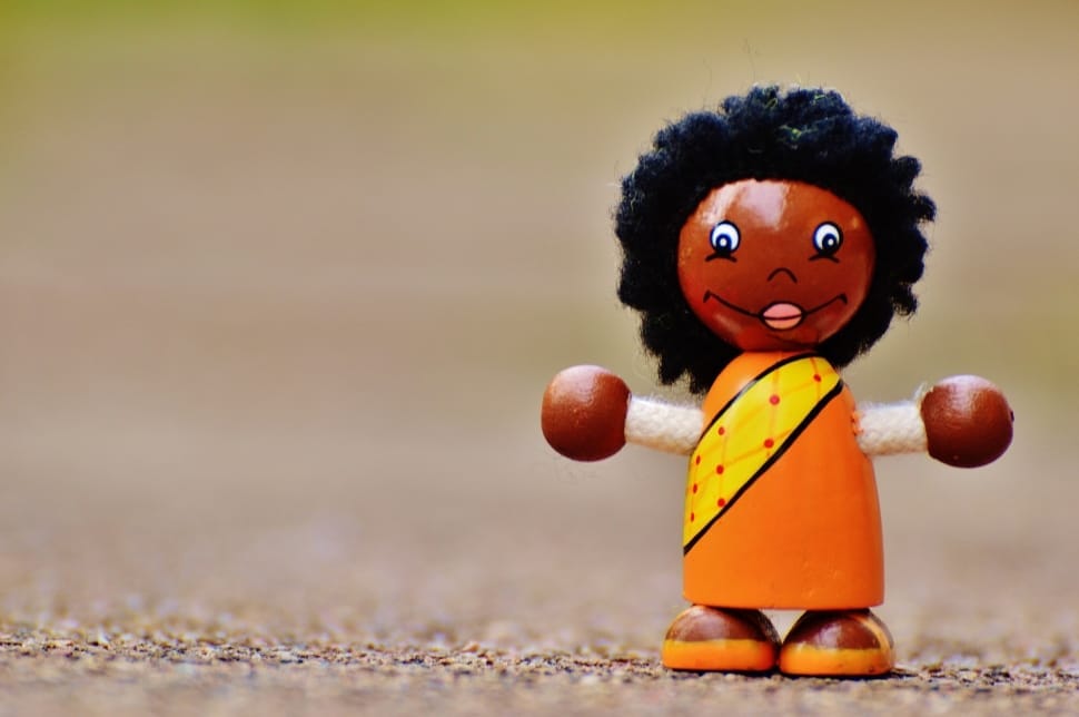 woman in orange dress wooden lace toy preview