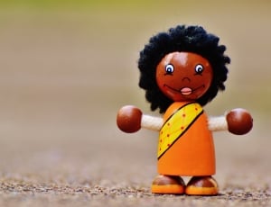 woman in orange dress wooden lace toy thumbnail