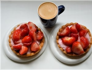 strawberries and black ceramic mug with coffee inside thumbnail